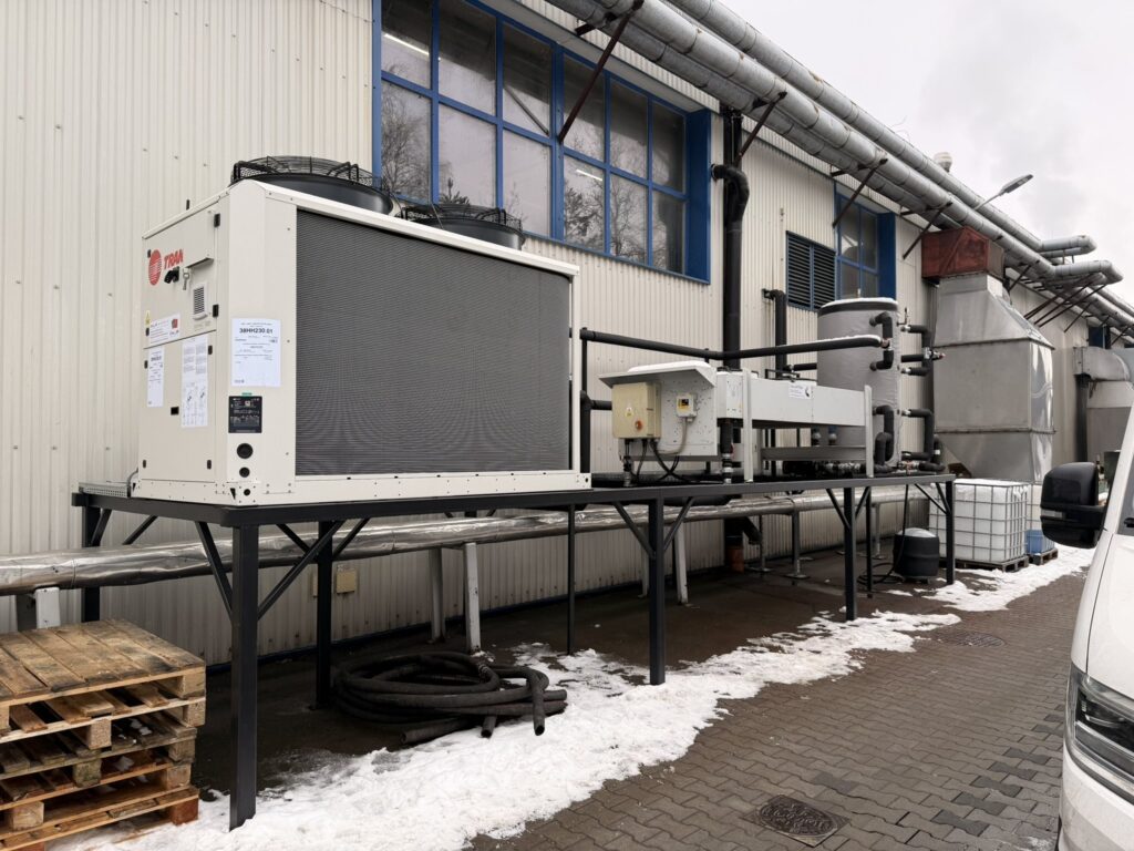 Air-cooled chiller next to a production hall in winter