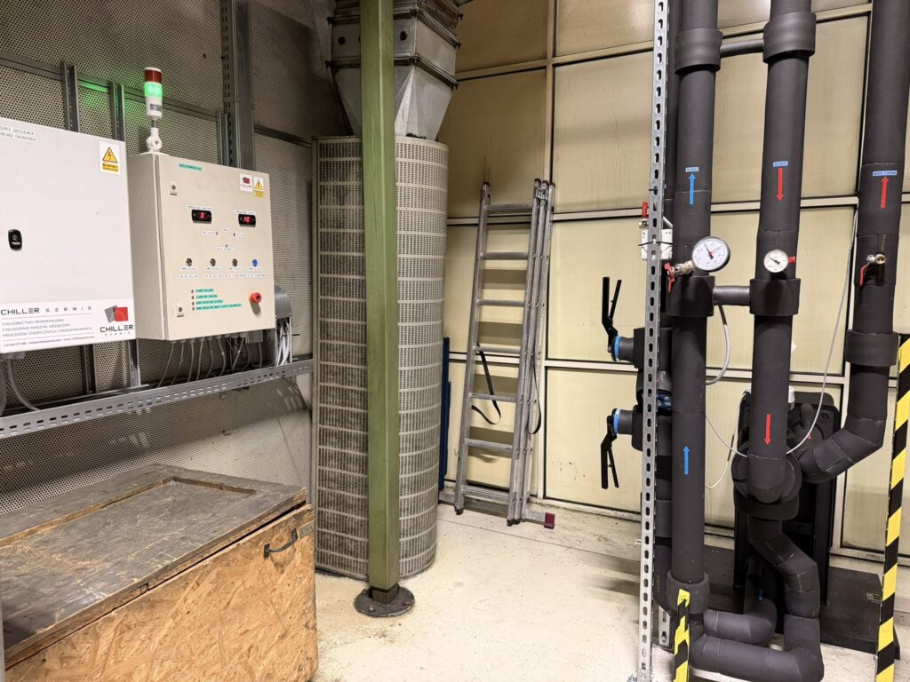 Chiller plant room with control panels and pipework