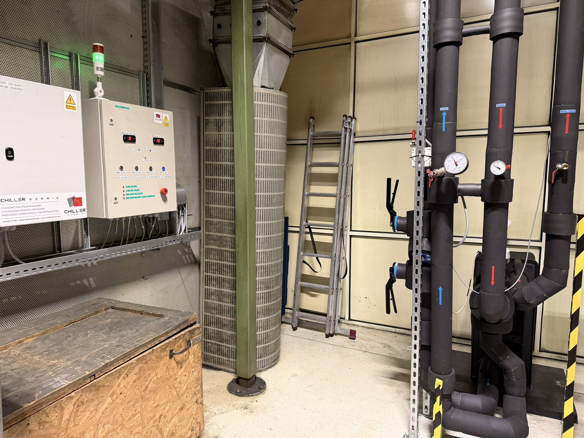 Chiller plant room with control panels and pipework