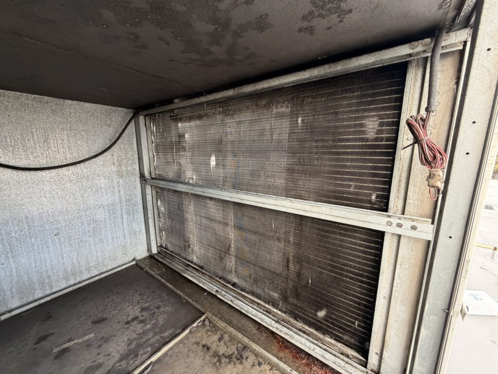 Condenser coil of a rooftop unit before chemical cleaning