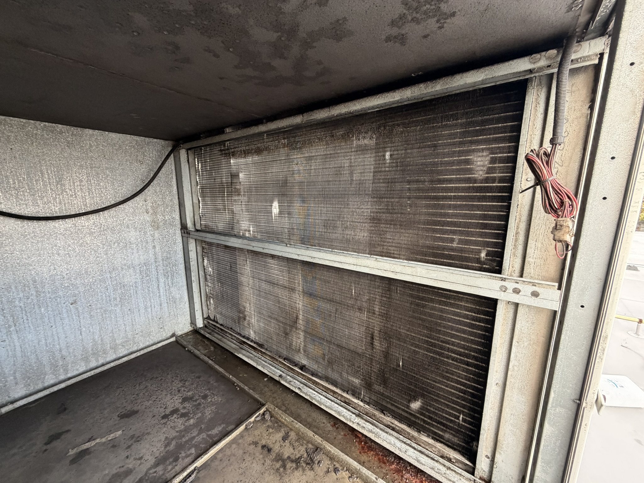 Condenser coil of a rooftop unit before chemical cleaning
